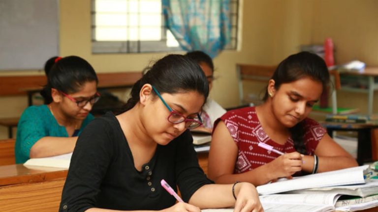 Students entering a government junior college building in Andhra Pradesh for new academic session
