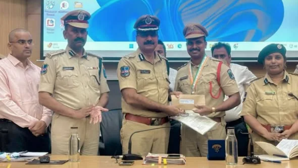 Telangana Police officers proudly receiving the Charminar Trophy at the 69th All India Police Duty Meet in Nagpur.