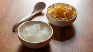 Edible Gond Katira crystals and soaked jelly form in a glass bowl for summer hydration.