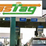 Toll plaza gates on Hyderabad to Vijayawada highway with vehicles passing through FASTag lanes
