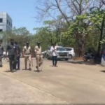 Police bomb disposal squad conducting a security search at JNTU Hyderabad campus building