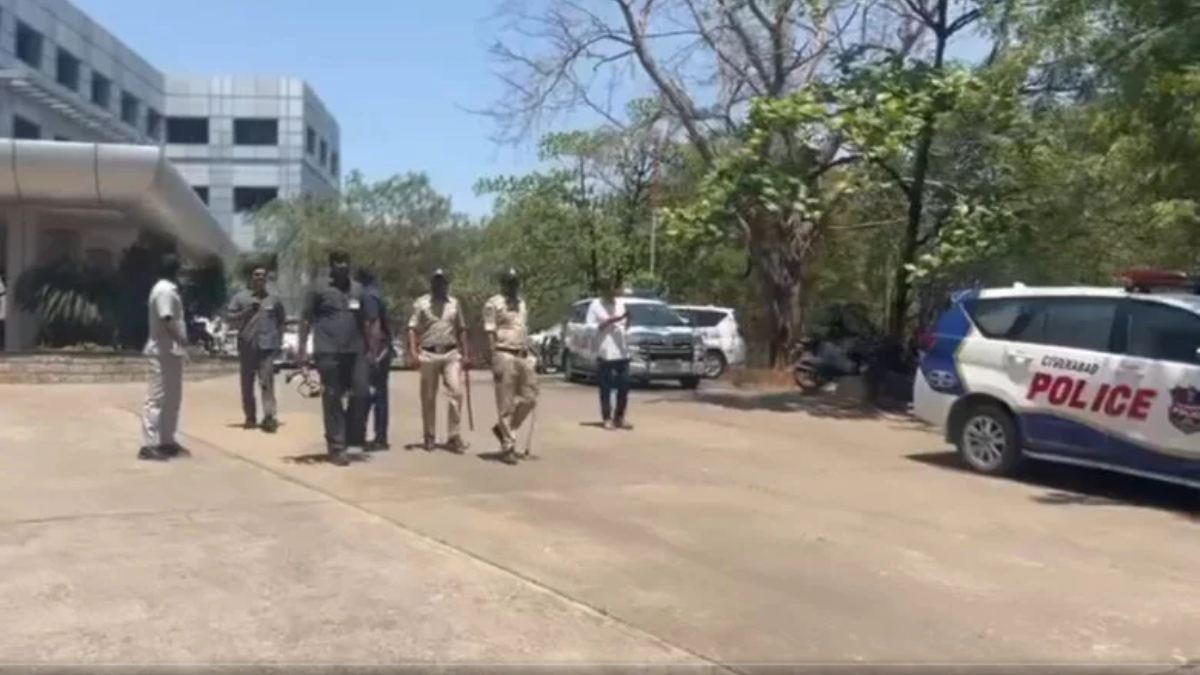 Police bomb disposal squad conducting a security search at JNTU Hyderabad campus building