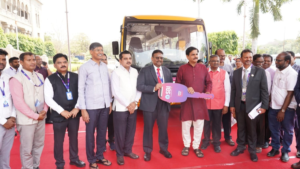 Three new buses donated by SBI parked in front of the historic Osmania University Arts College building.