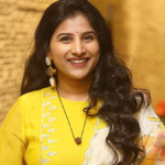 Popular Telugu folk singer Mangli (Satyavathi Chauhan) during a performance.