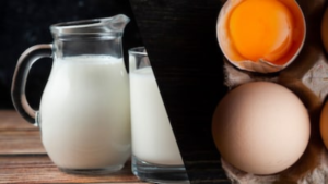 A person holding a glass of milk and a boiled egg, illustrating Vitamin D sources for a healthy lifestyle.