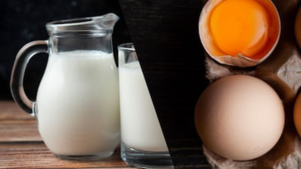 A person holding a glass of milk and a boiled egg, illustrating Vitamin D sources for a healthy lifestyle.
